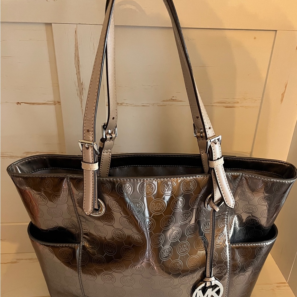 PRICE DROP !!!!Michael Kors Silver Jet Set Tote .Great  statement bag!!